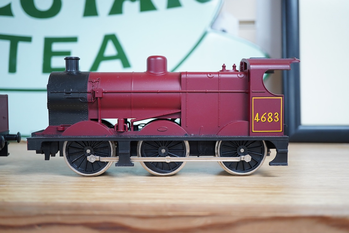 Eleven 0 gauge model railway items including; a bogie stake wagon, two mineral wagons, a North British coal wagon and two further open wagons, a partly constructed brake van, together with a Lima LMS 4F locomotive, two L